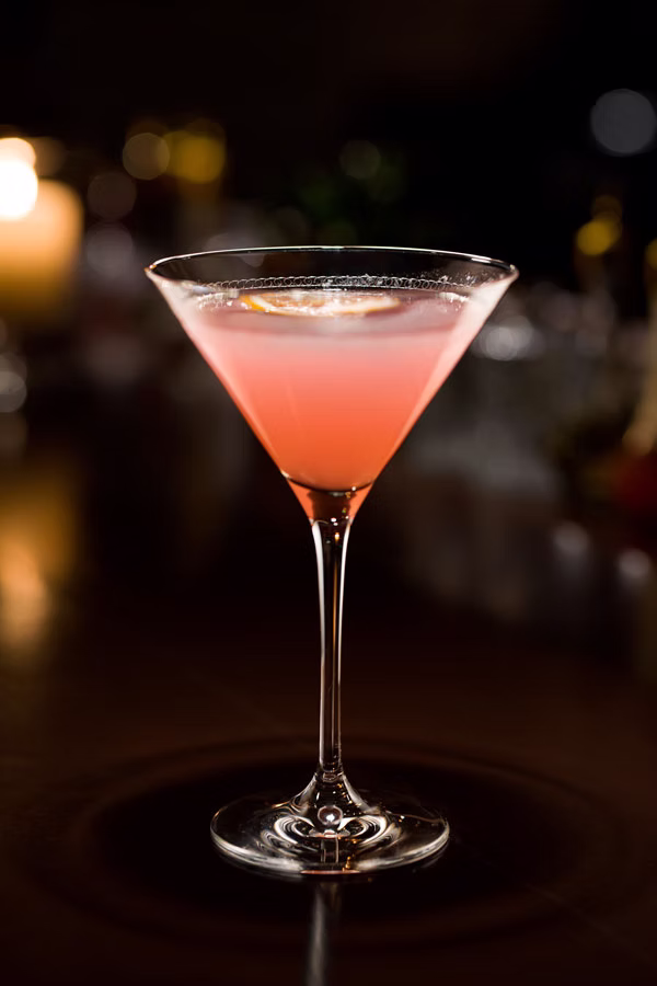 Signature pink cocktail in a coupe glass